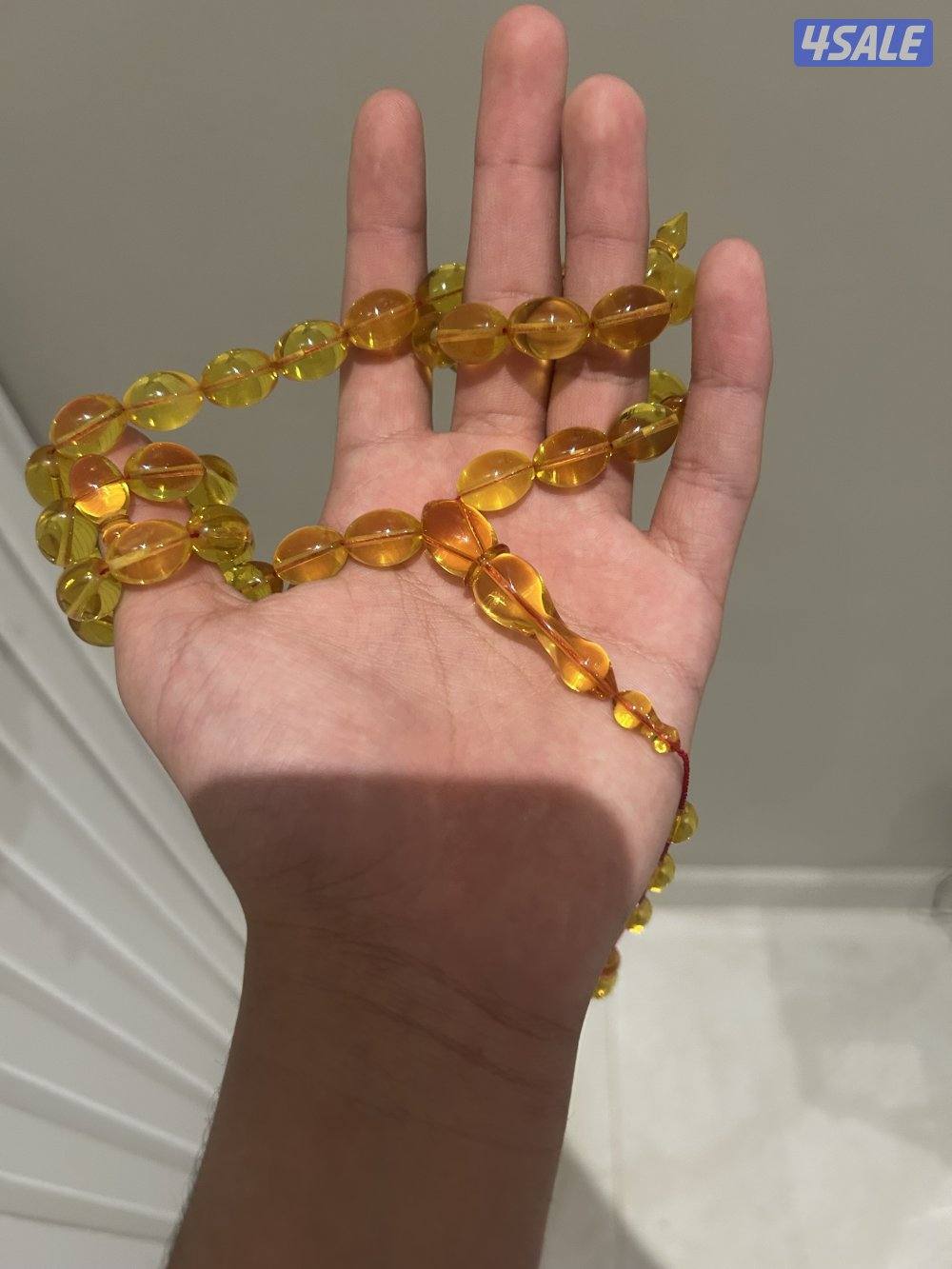 مسباح كهرب بولندي شفاف ب قصة الزيتون. لون المسباح غامج و وزنه ٥١ غرام1