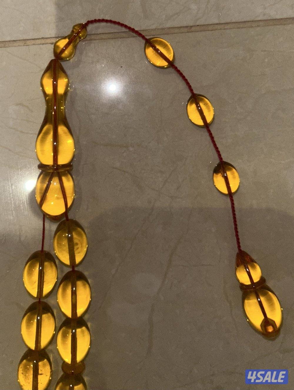 مسباح كهرب بولندي شفاف ب قصة الزيتون. لون المسباح غامج و وزنه ٥١ غرام3