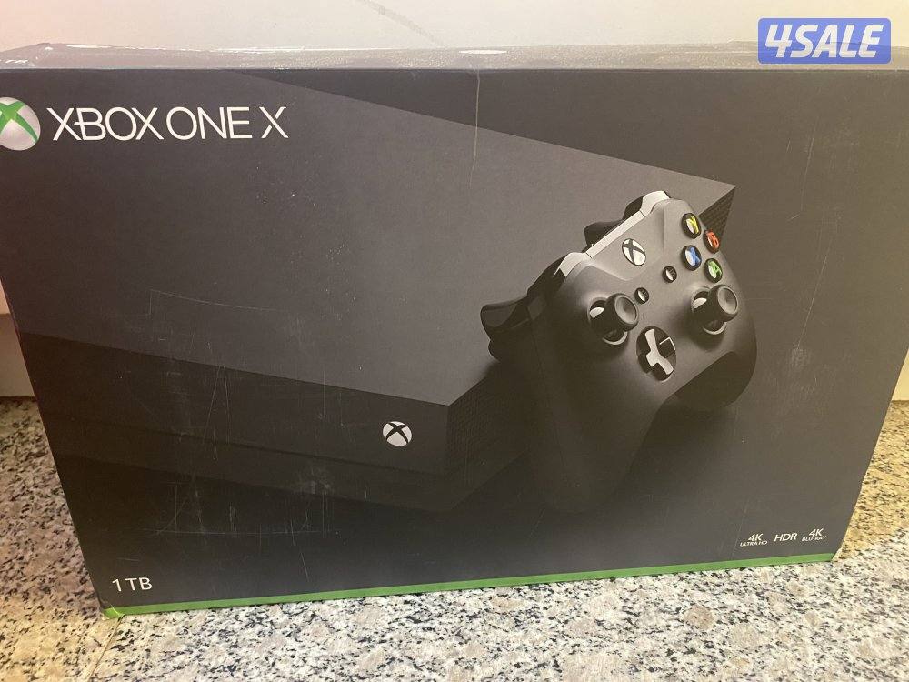 X-box1x black with black controller  1t  new used for only one week1