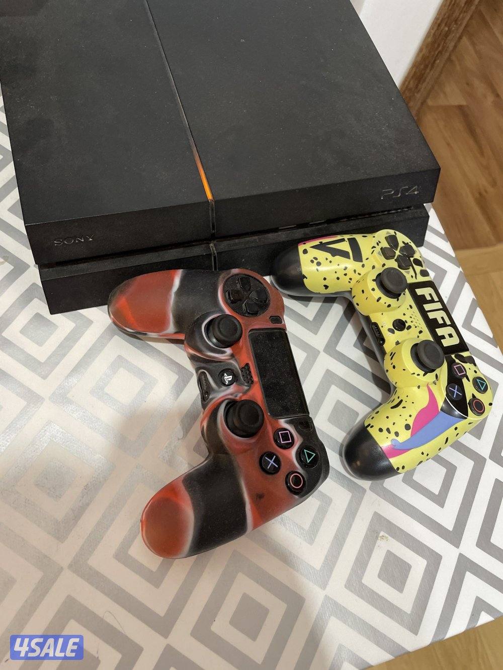 PS4 in good condition with two controllers and cd1