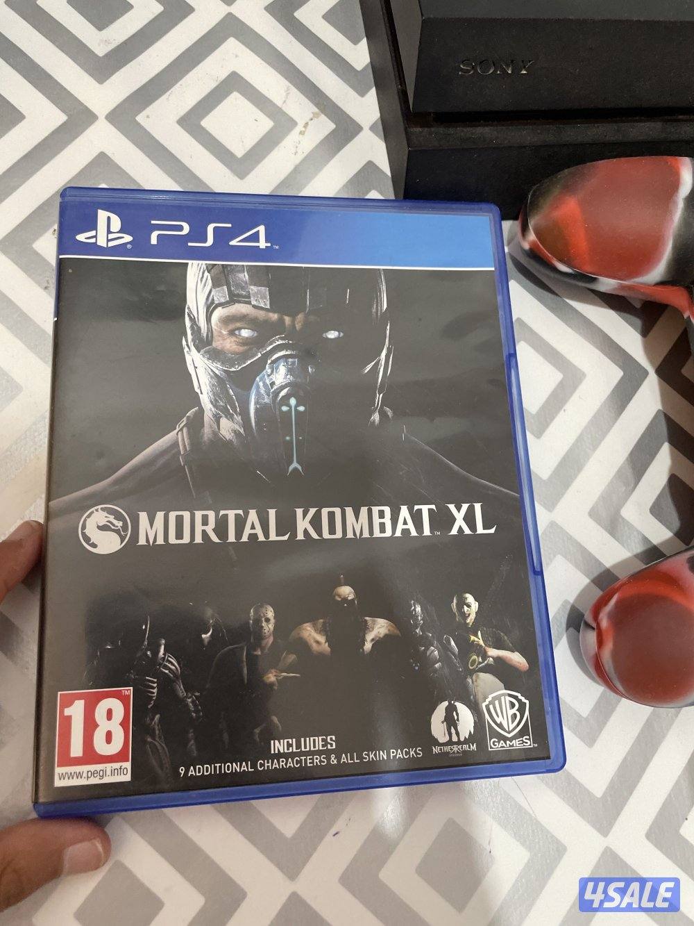 PS4 in good condition with two controllers and cd3